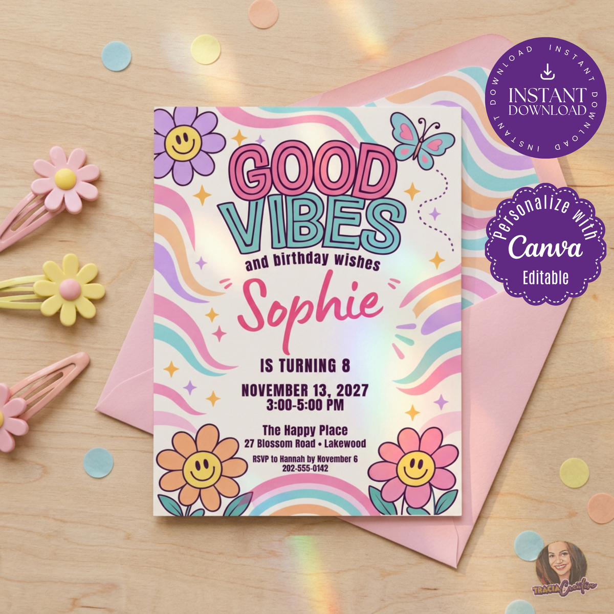 Good Vibes birthday invitation with smiling flowers, a butterfly and pastel rainbow waves, beside a pink envelope.